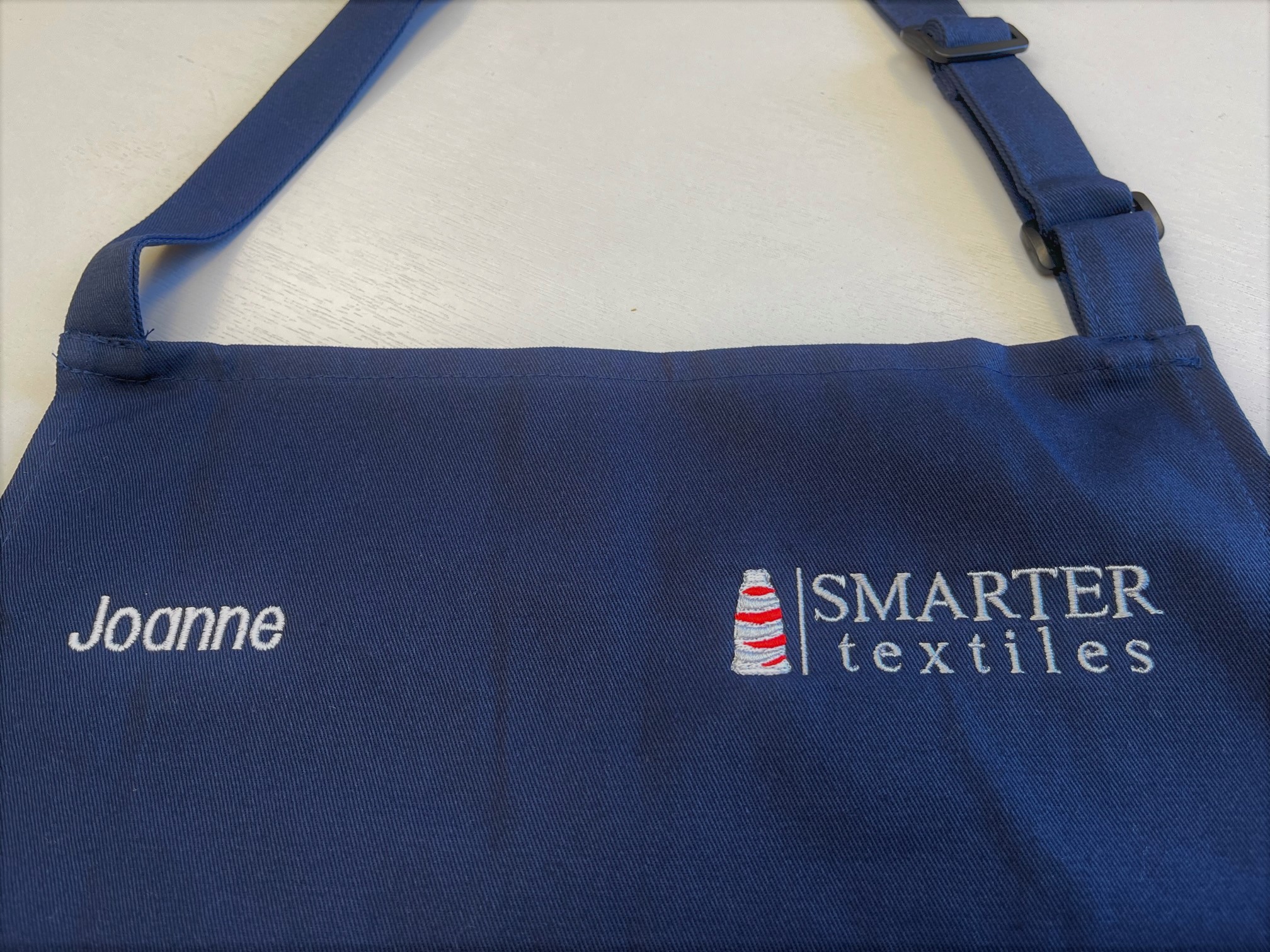 small logo on apron