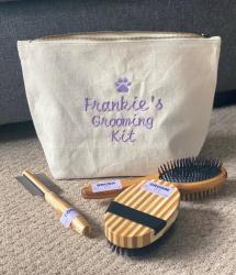 Dog grooming bag with brushes